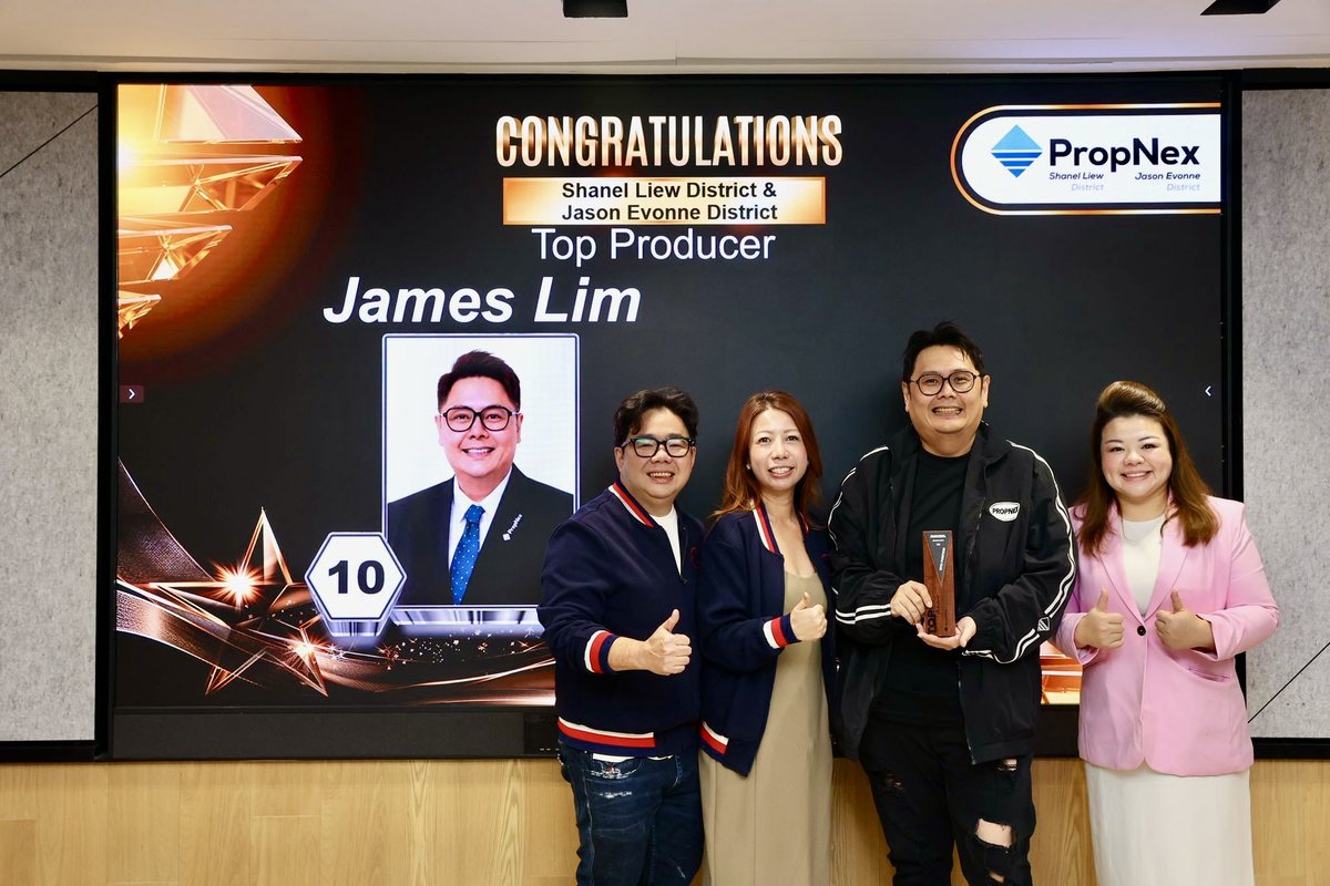 James Lim named Top Producer on the PropNex awards stage with his team.