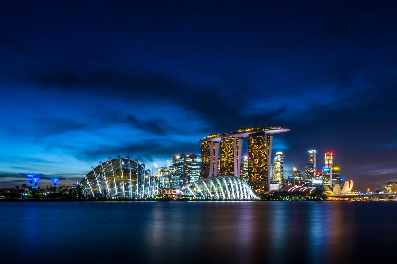 The Marina Bay skyline at dusk, with Marina Bay Sands and the Gardens by the Bay Supertrees.